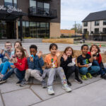 A group of children eats ice cream outside The Eloise